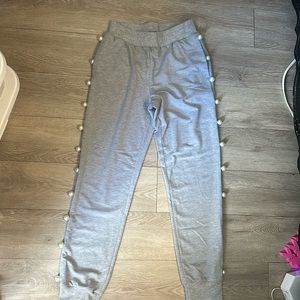 Heather gray sweatpants with pearl embellishment on the side